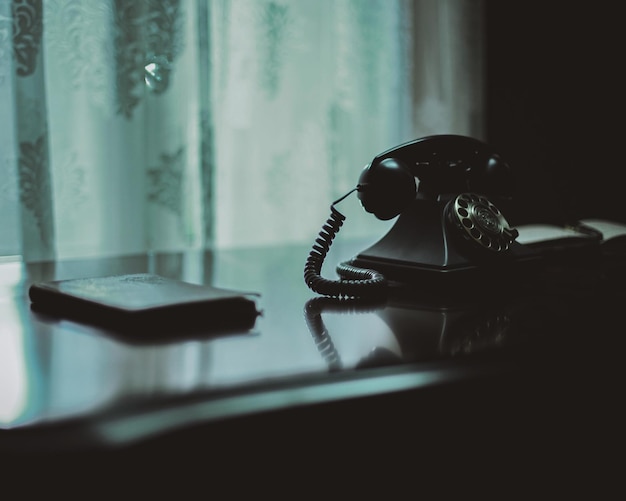 Close-up of rotary phone on table