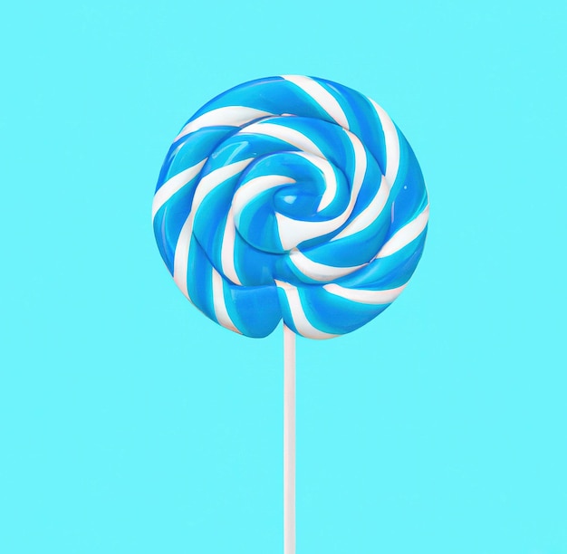 Close up of round blue and white lollipop on blue background