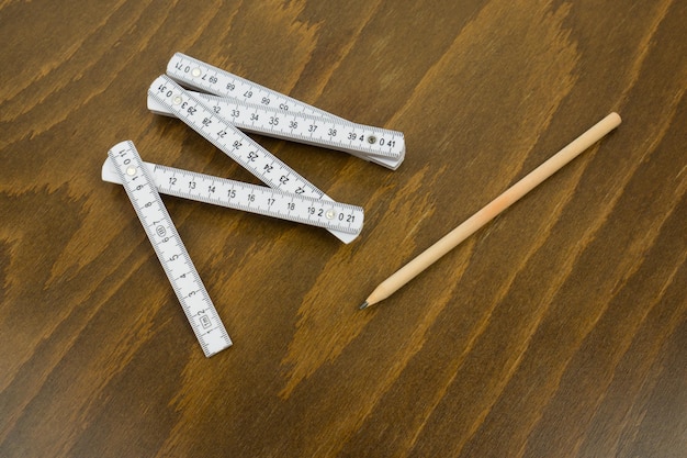 Close-up of rulers and pencil on table