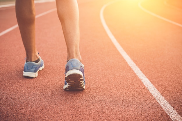 Close up runner feet on running stadium