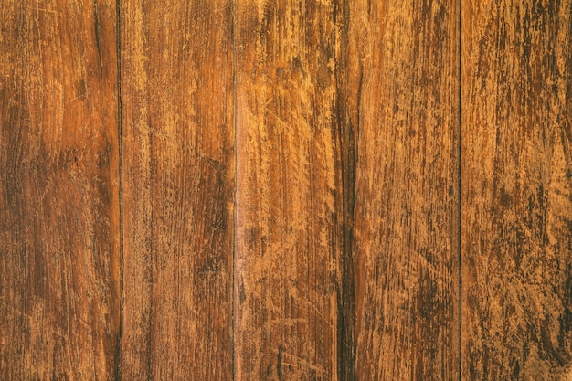 Close up rustic wood table surface with grunge texture in vintage style.