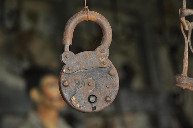 Close-up of rusty metal chain lock