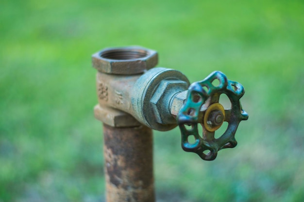 Close-up of rusty metal on field