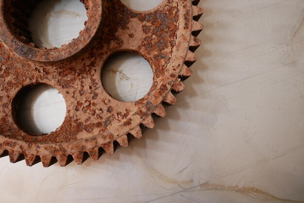 Close-up of rusty metal on floor in building