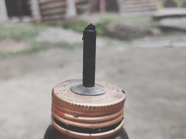 Close-up of rusty metal pole against blurred background