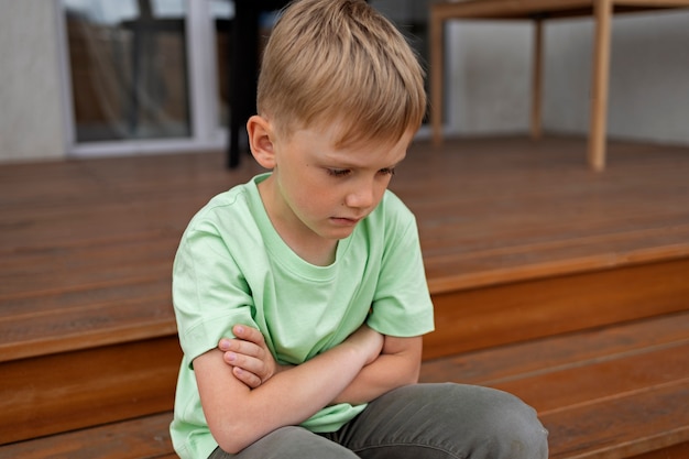 Photo close up on sad boy portrait