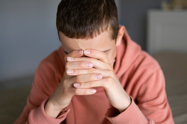 Photo close up on sad boy portrait