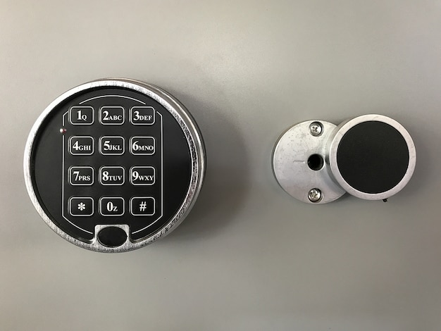 Photo close up of safe with keypad digital lock  background