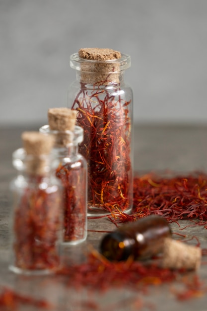 Photo close up on saffron in small bottles