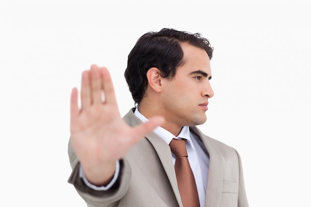 Close up of salesman signalizing stop 