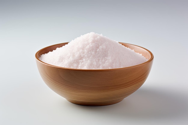 Close up of salt on bowl isolated white background