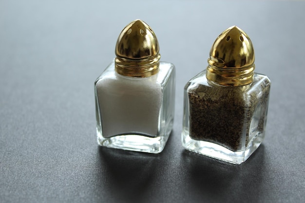 Close-up of salt and pepper shaker on table