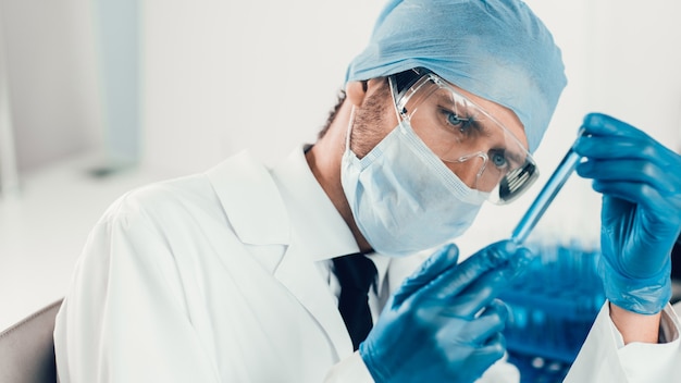 Close up. sample of the vaccine in the hands of a scientist . photo with a copy-space.