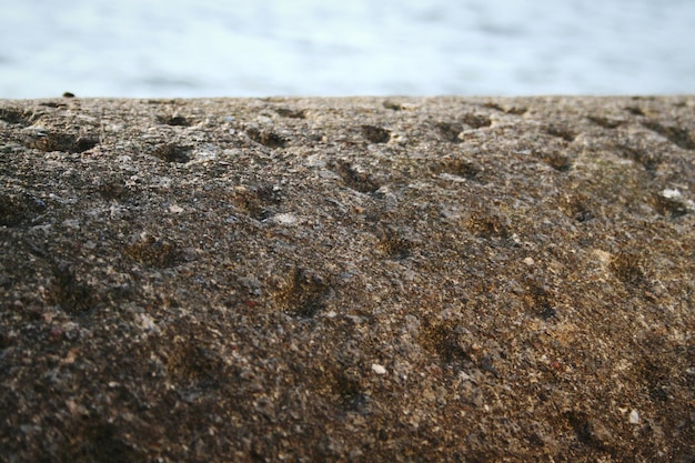 Close-up of sand on beach against sky