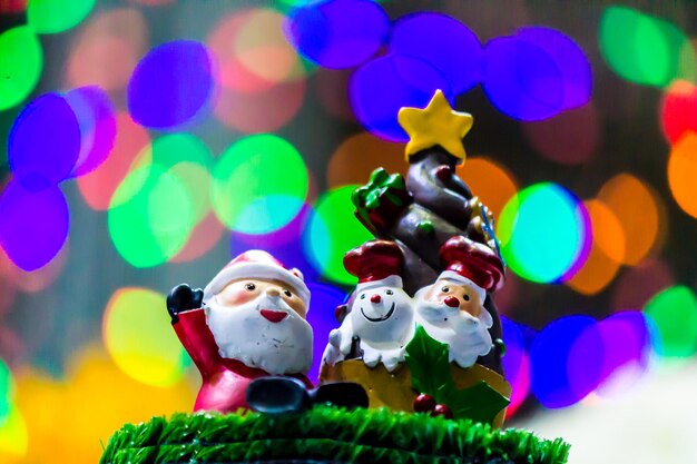 Photo close-up of santa claus against illuminated background