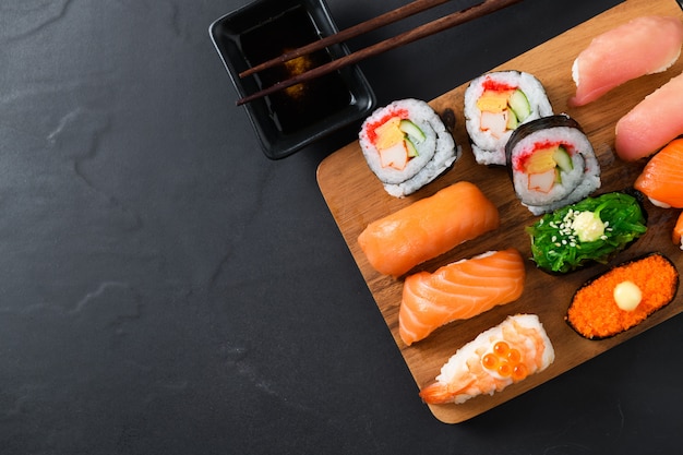 Close up of sashimi sushi set with chopsticks 