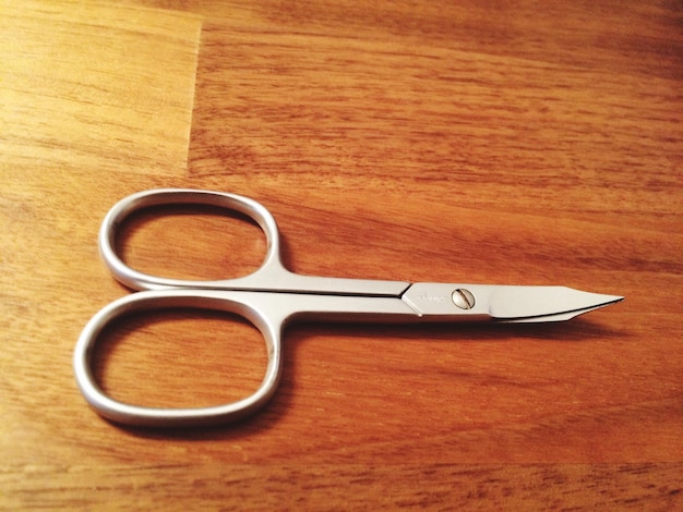 Close-up of scissors on table