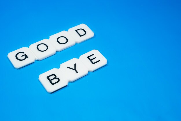 Photo close-up of scrabble words over blue background