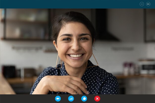 Close up screen view portrait of happy young indian woman have\
webcam online conversation or digital virtual conference smiling\
millennial ethnic female have fun talk speak on video call at\
home