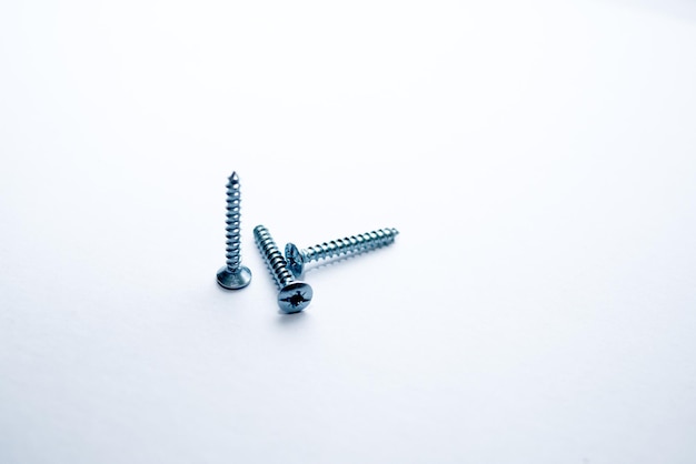 close-up of screws on white background