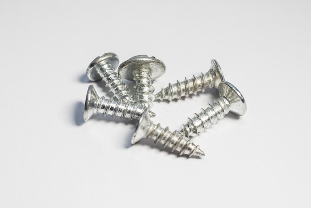 close up of screws on white background