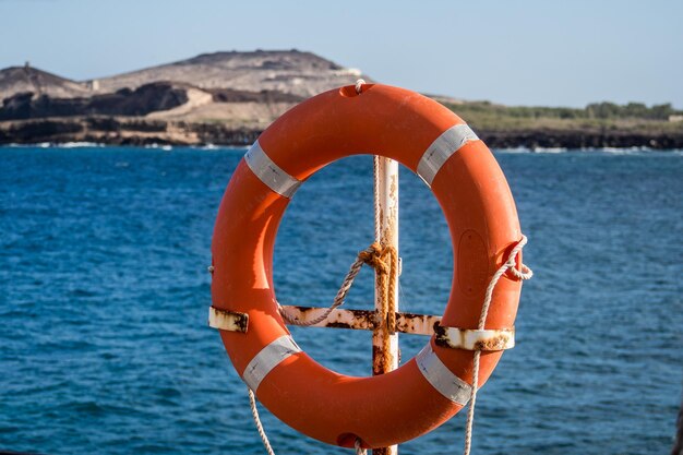 Close-up of sea against orange sky