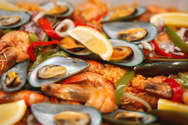 Close-up of seafood paella served on table