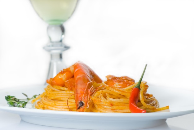 Photo close-up of seafood with drink against white background