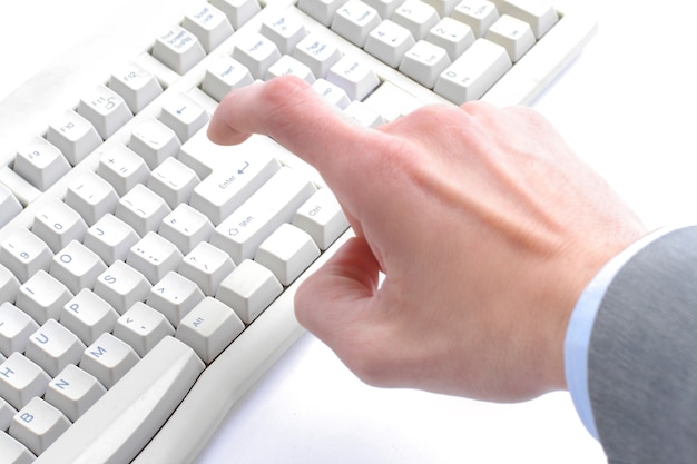 Photo close-up of secretary hand touching computer keys during work.