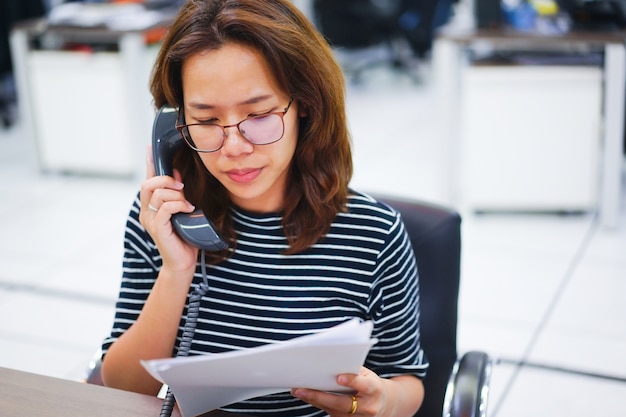 close up secretary woman speaking on telephone 