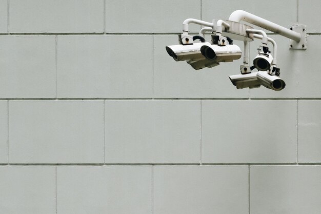 Photo close-up of security camera on wall