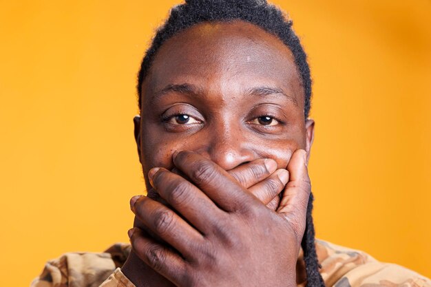 Close-up of senior man against yellow background