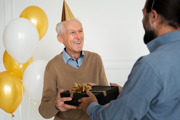 Close up senior man receiving present