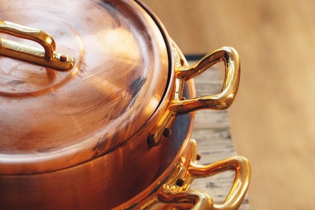 Close up of a set of copper cookware