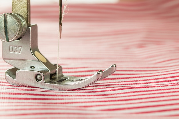 Photo close-up of sewing machine and fabric