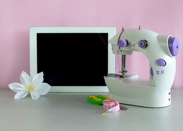 Close-up of sewing machine for online sewing courses. Distance learning, master classes, master classes, webinar. Selective focus.