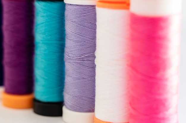 Close-up on sewing thread spools