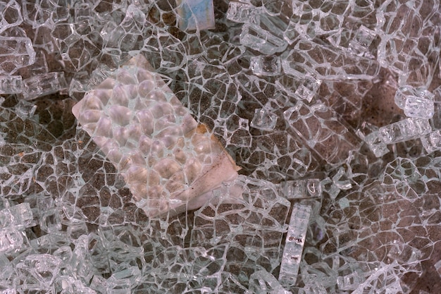 A close up of Shattered glass on the floor