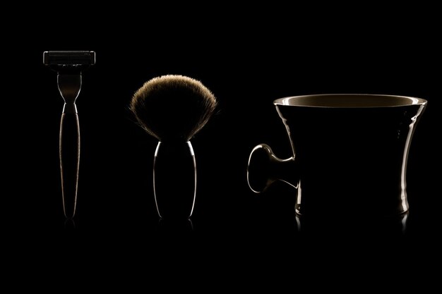 Close-up of shaving equipment against black background