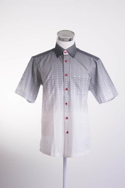 Close-up of shirt in mannequin against gray background