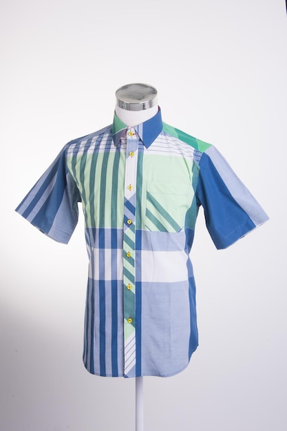 Close-up of shirt on mannequin against white background