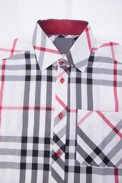 Photo close-up of shirt over white background