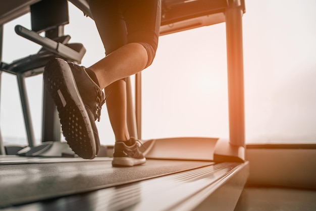 Close up on shoe,Women running in a gym on a treadmill.exercising concept.fitness and healthy lifestyle.