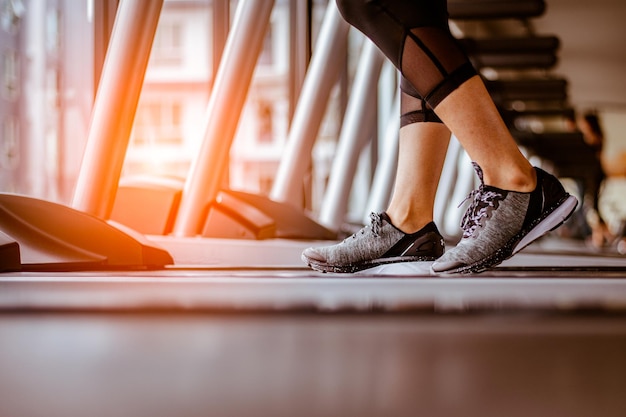 Close up on shoe,women running in a gym on a
treadmill.exercising concept.fitness and healthy lifestyle