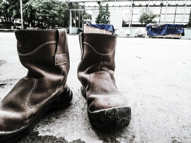 Photo close-up of shoes on floor in city