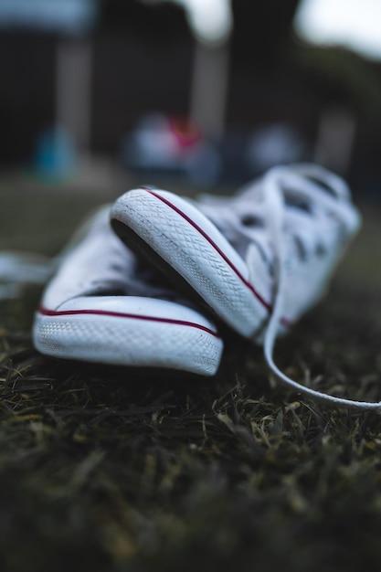 Photo close-up of shoes on grassy land