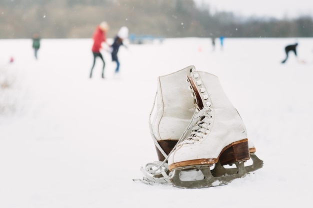 close-up of shoes on snow covered landscape