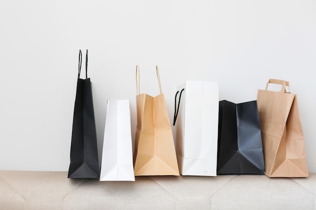 Photo close-up of shopping bags against white background