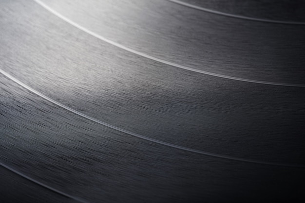 Close-up shot of 12-inch LP vinyl record groove. Macro photo.