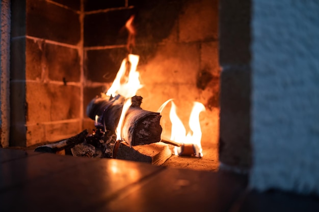 Close up shot of burning firewood in the fireplace